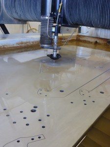wider view of the waterjet cutting so you can see multiple parts