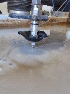 Close up of the waterjet cutting our steel